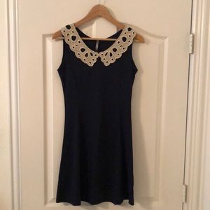 Navy dress with gold/white detail